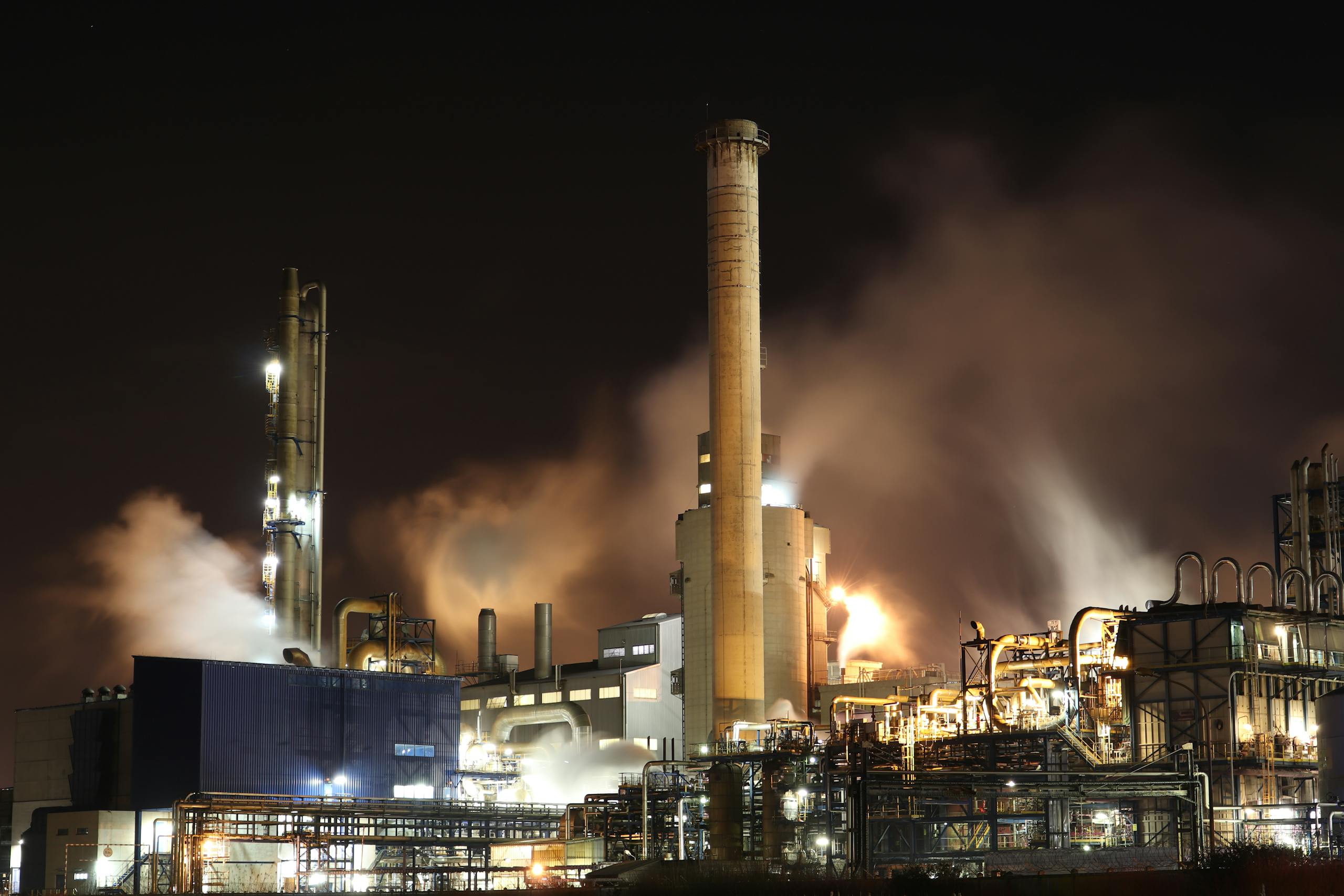 Brown and White Factory Building during Night Time